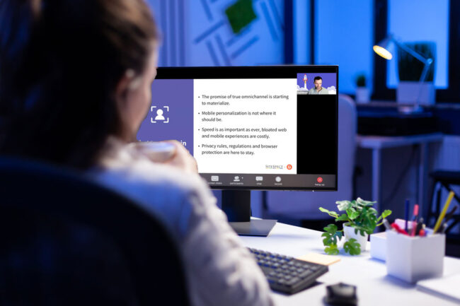 Person at computer watching webinar.